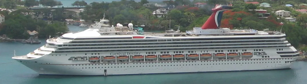 Cruise ship berthed at Pointe Seraphine with tour boats waiting in Castries harbour, Saint Lucia